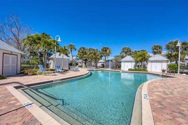a view of a swimming pool and a chair