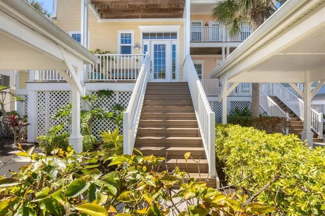 a view of a house with backyard and deck