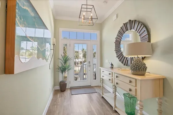 a living room with furniture ceiling fan and a flat screen tv