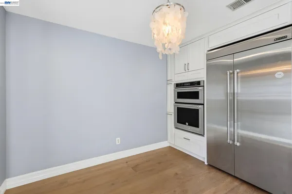 a view of a refrigerator in kitchen