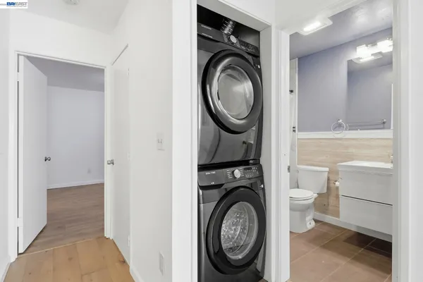 a view of a hallway with washer and dryer