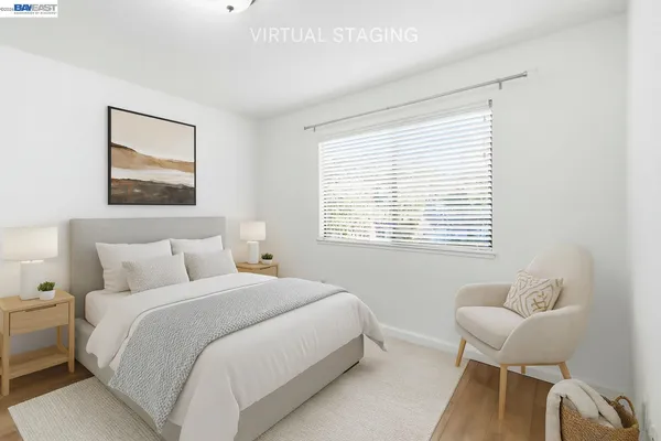 a bedroom with a bed and a chair