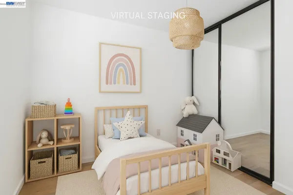 a bedroom with a bed and a mirror