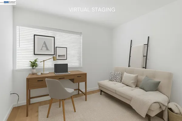 a workspace with furniture and window