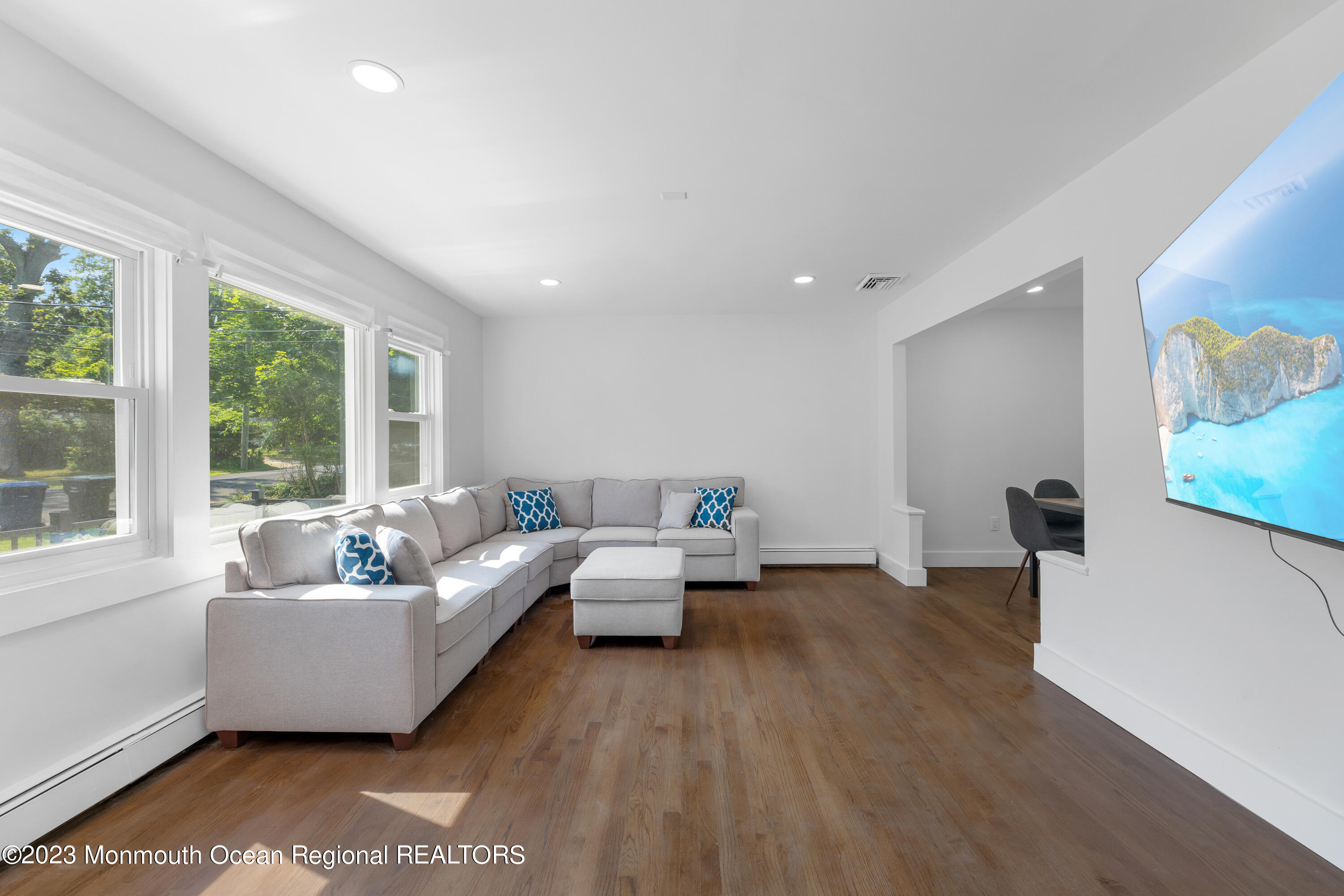 186 Delaware Avenue, Unit WINTER Oakhurst, NJ 07755 - Photo 19 of 31 a living room with furniture and a large window