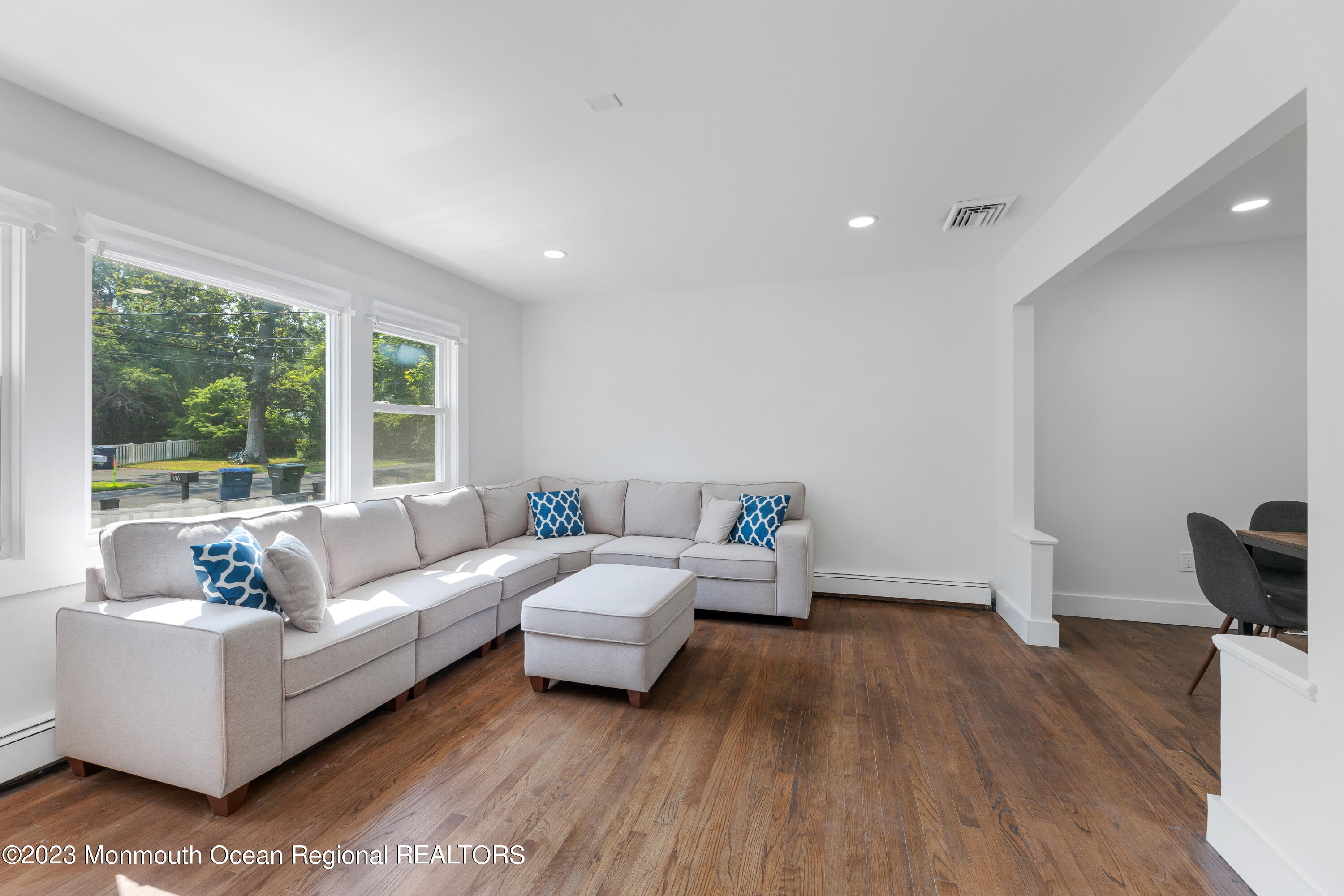 186 Delaware Avenue, Unit WINTER Oakhurst, NJ 07755 - Photo 20 of 31 a living room with furniture and a large window