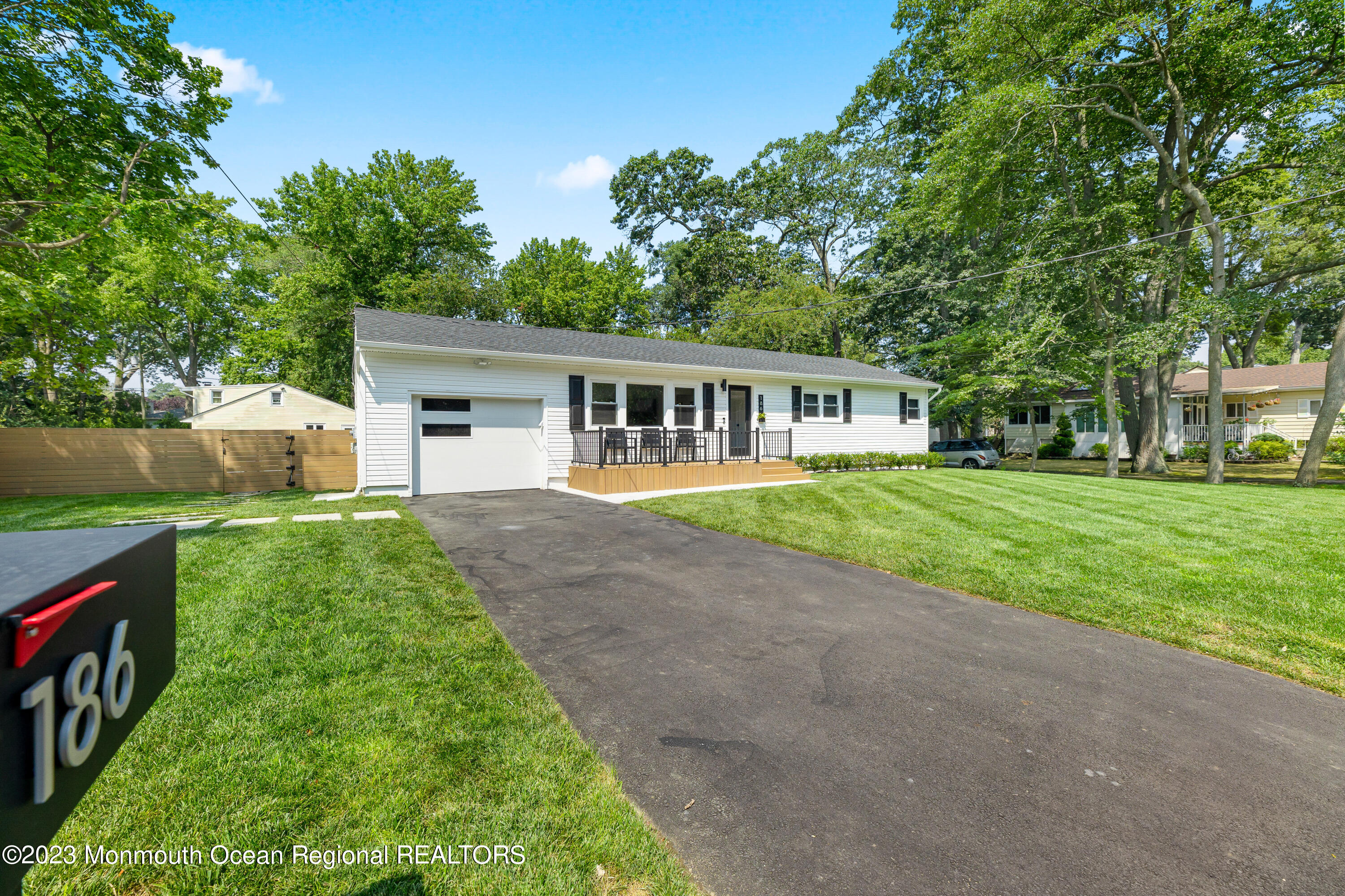 186 Delaware Avenue, Unit WINTER Oakhurst, NJ 07755 - Photo 2 of 31 a house view with a garden space