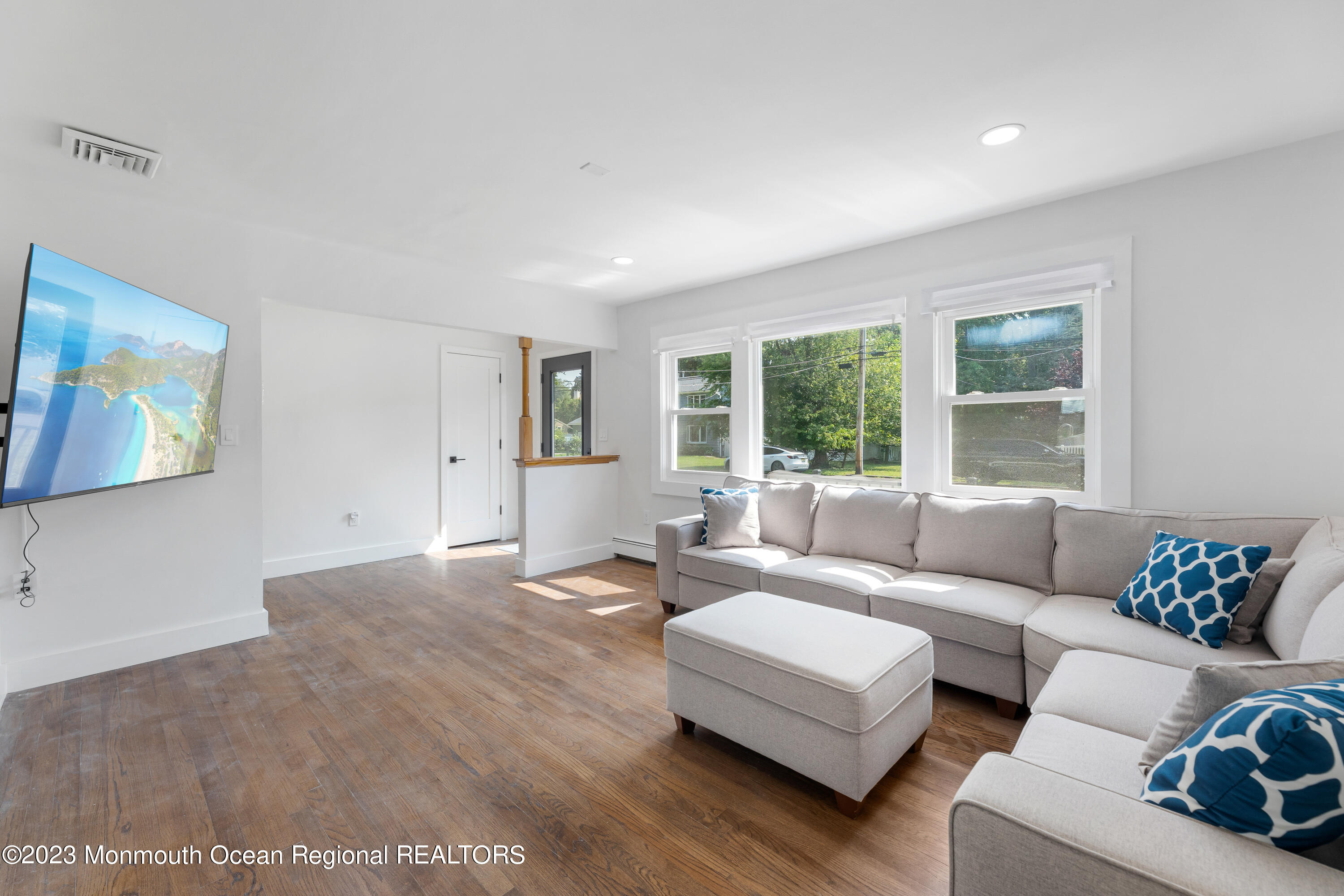 186 Delaware Avenue, Unit WINTER Oakhurst, NJ 07755 - Photo 21 of 31 a living room with furniture and a window