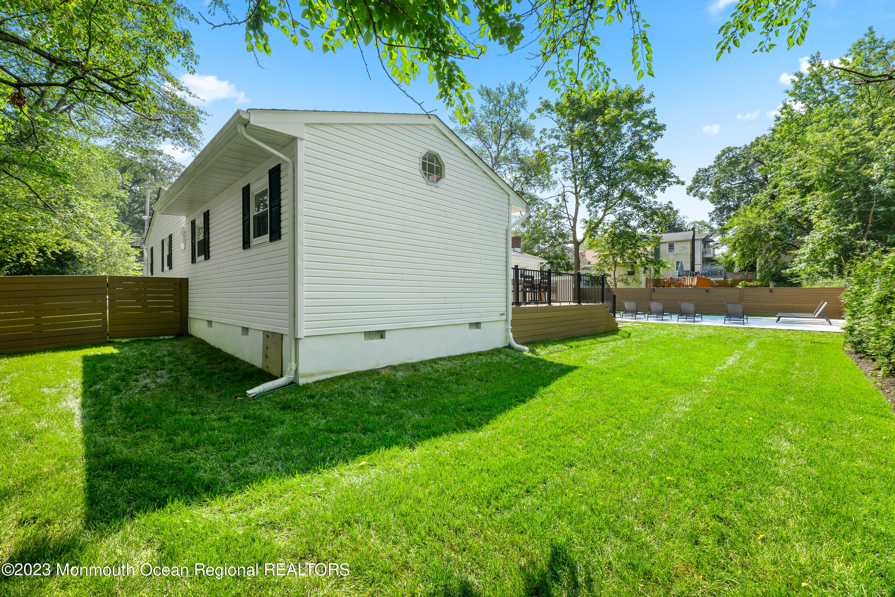 186 Delaware Avenue, Unit WINTER Oakhurst, NJ 07755 - Photo 25 of 31 a view front of house with a yard