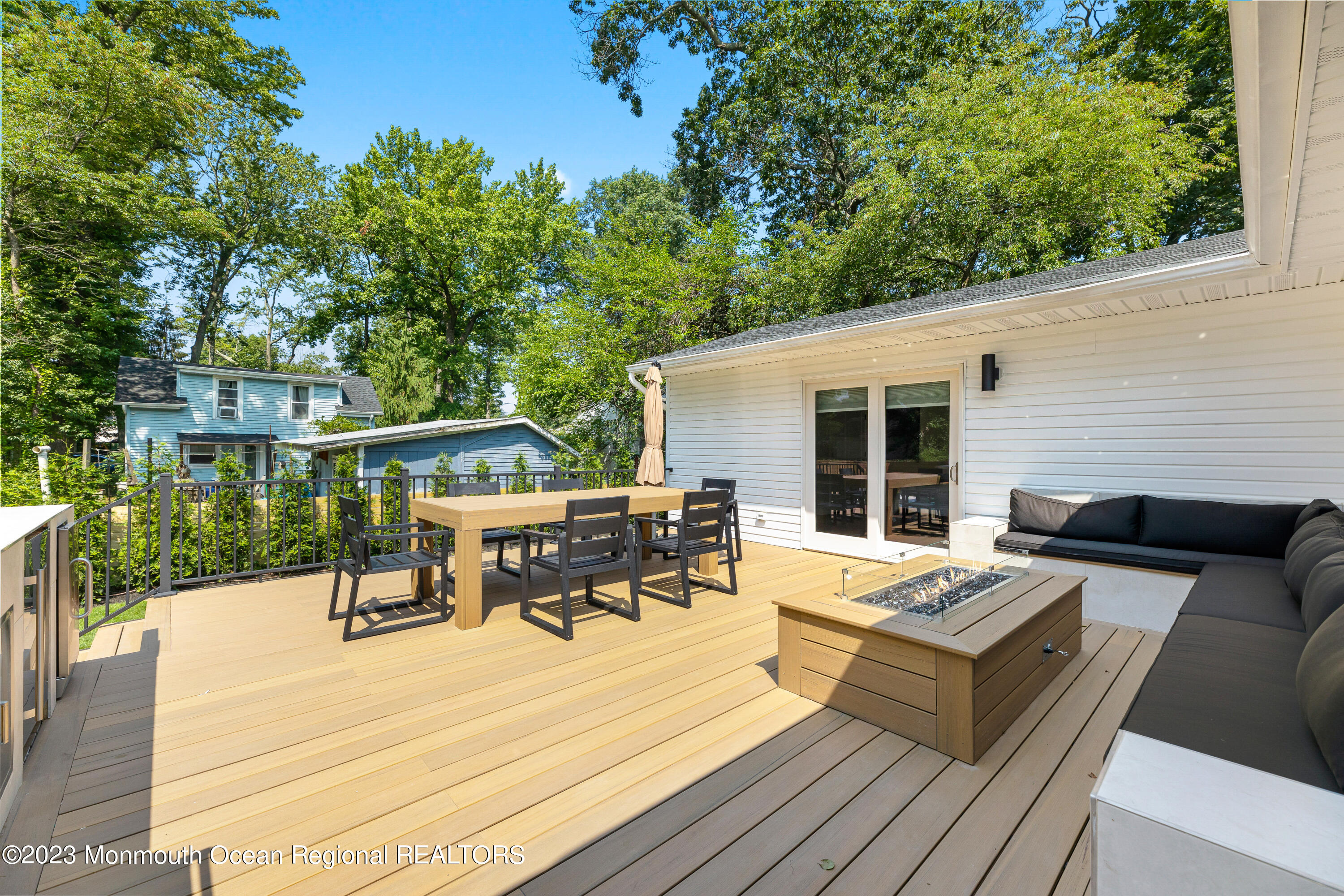 186 Delaware Avenue, Unit WINTER Oakhurst, NJ 07755 - Photo 26 of 31 a view of a patio with couches table and chairs and potted plants