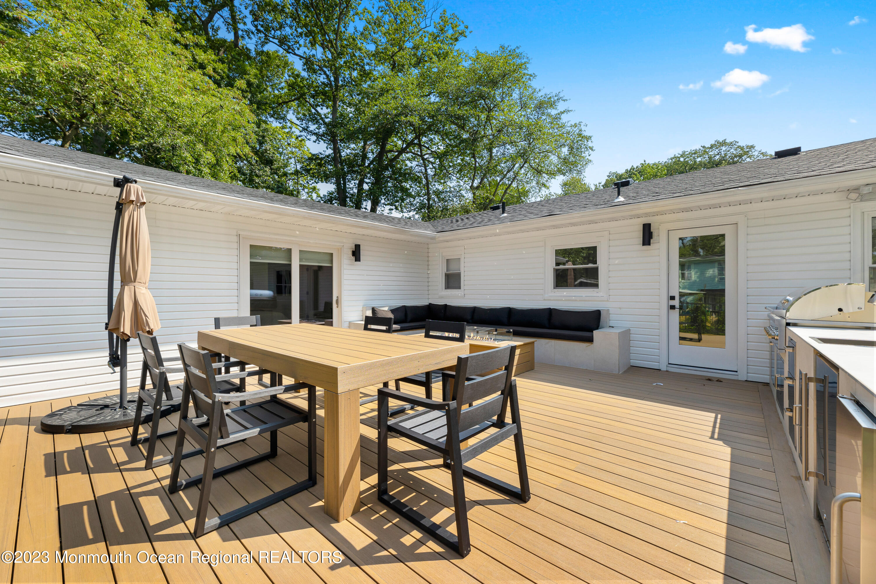 186 Delaware Avenue, Unit WINTER Oakhurst, NJ 07755 - Photo 29 of 31 a view of a dinning table and chairs in patio of the house