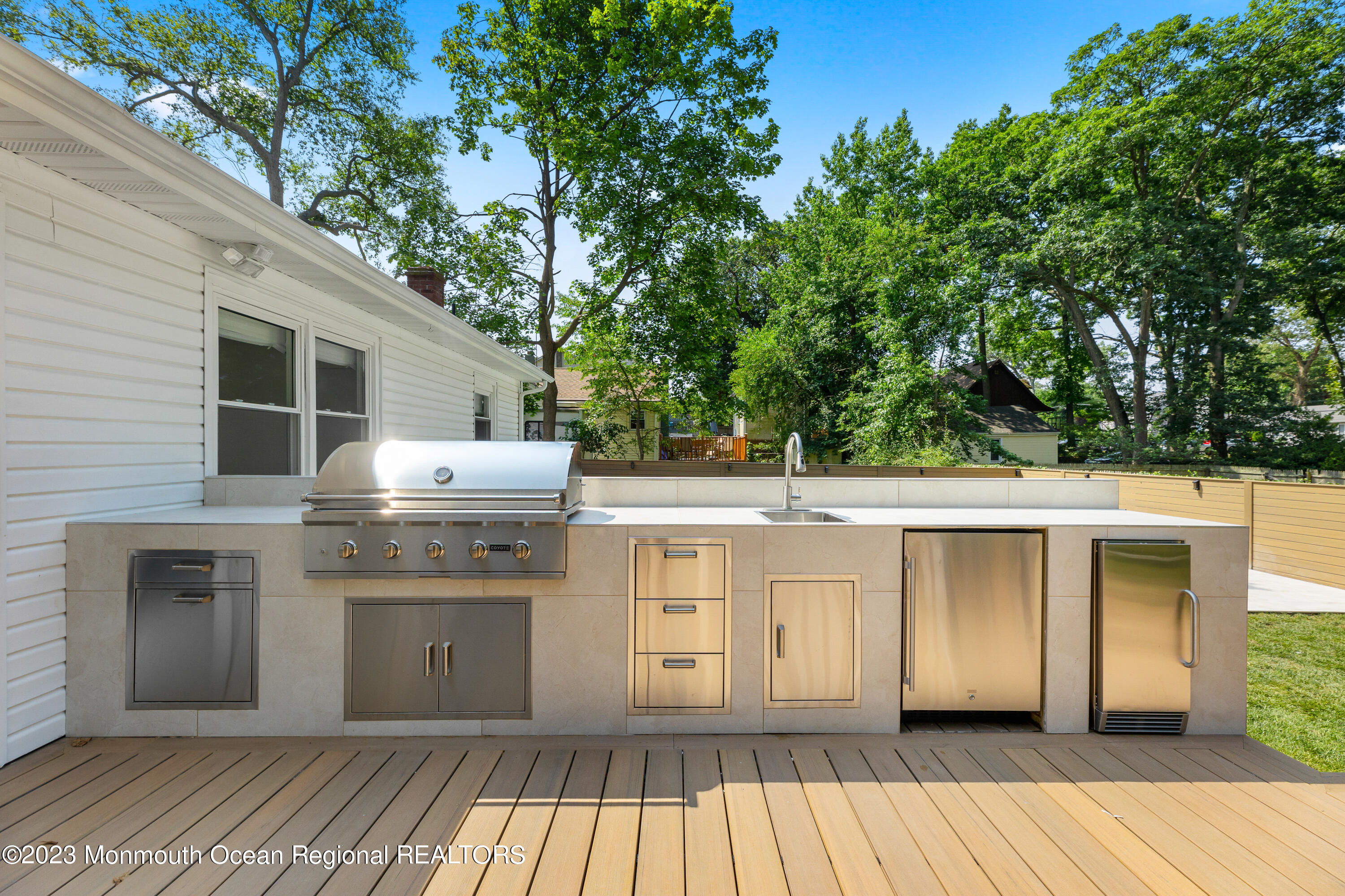 186 Delaware Avenue, Unit WINTER Oakhurst, NJ 07755 - Photo 30 of 31 a kitchen with a sink and cabinets