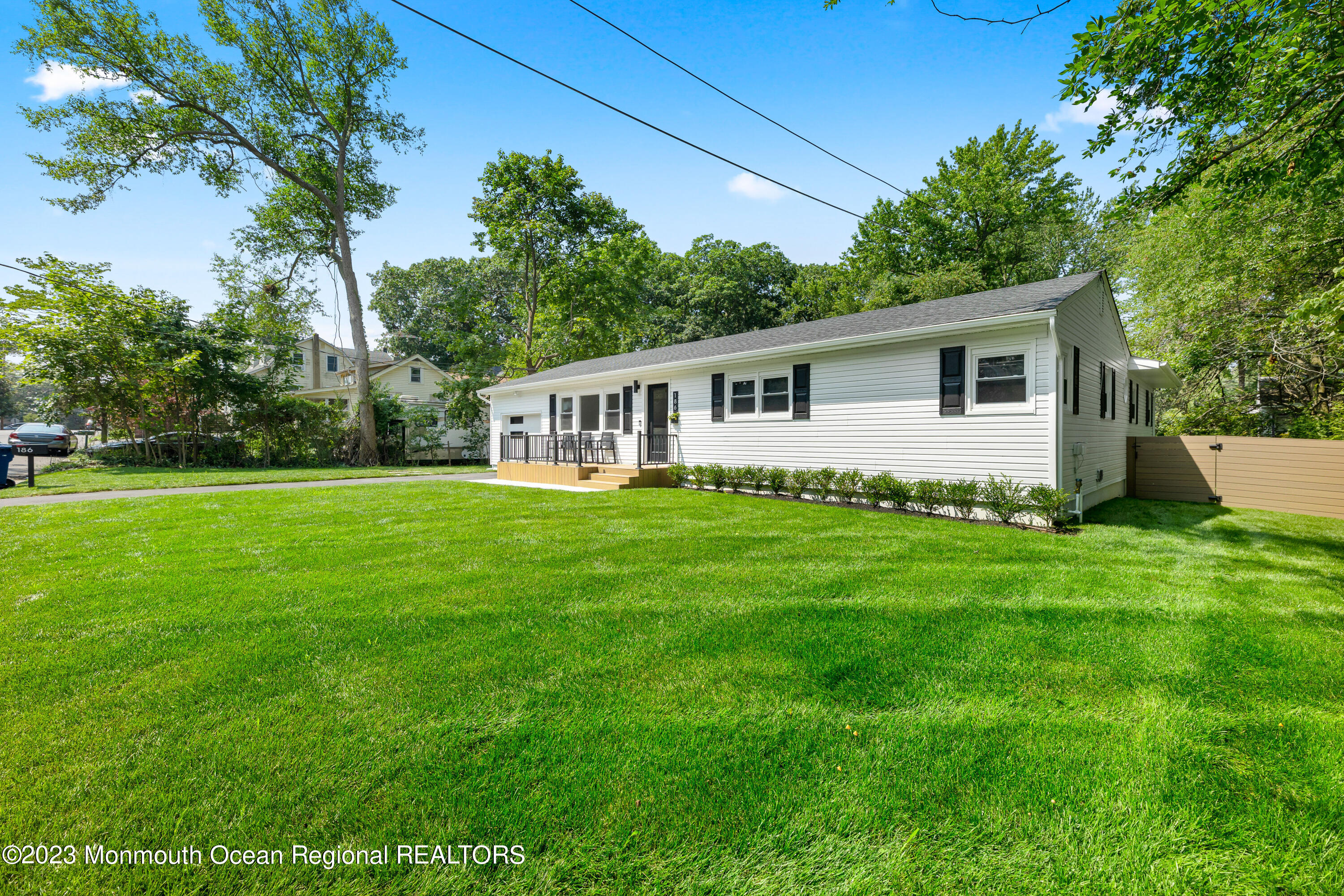 186 Delaware Avenue, Unit WINTER Oakhurst, NJ 07755 - Photo 3 of 31 a view of a house with backyard and garden