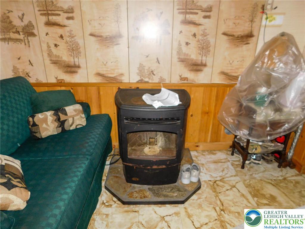 156 Pine Flats Colony Road Dingmans Ferry, PA 18328 - Photo 3 of 16 a living room with furniture and a fireplace