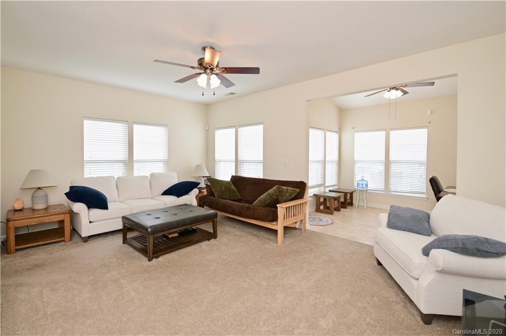 6152 Prosperity Church Road Charlotte, NC 28269 - Photo 15 of 33 a living room with furniture and a large window