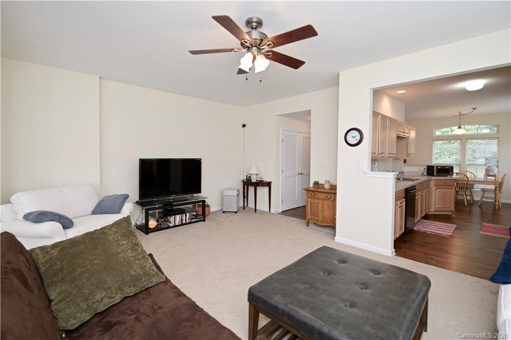 6152 Prosperity Church Road Charlotte, NC 28269 - Photo 16 of 33 a living room with furniture and a flat screen tv