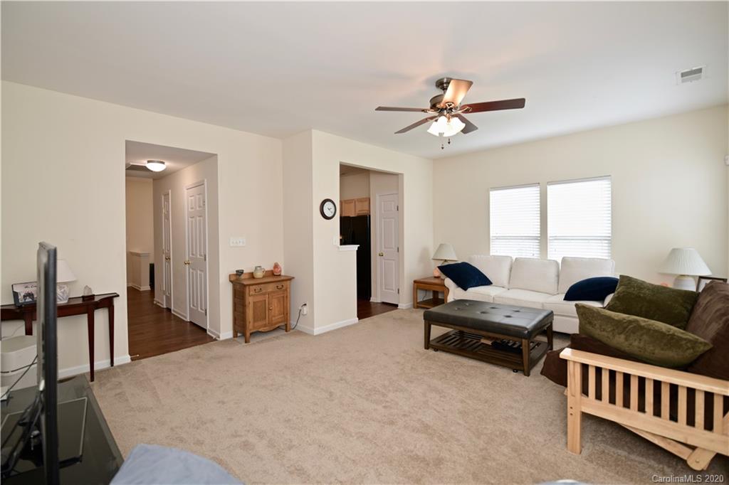 6152 Prosperity Church Road Charlotte, NC 28269 - Photo 17 of 33 a living room with furniture and a window