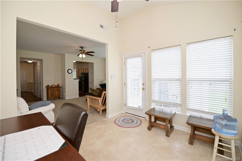 6152 Prosperity Church Road Charlotte, NC 28269 - Photo 20 of 33 a living room with furniture and a window
