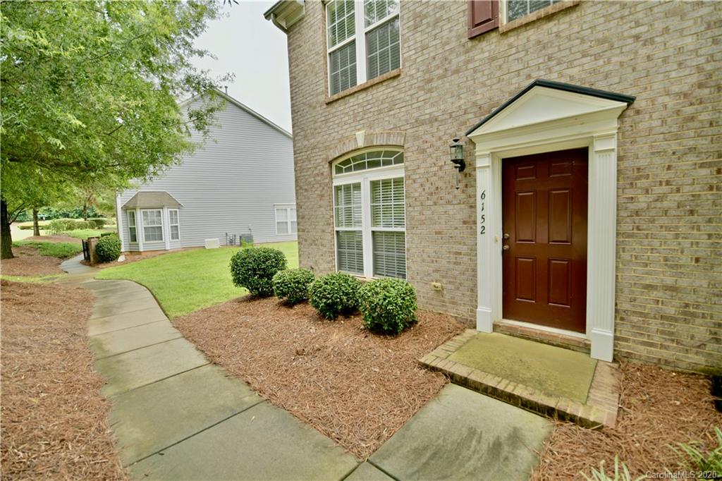 6152 Prosperity Church Road Charlotte, NC 28269 - Photo 3 of 33 a front view of a house with a yard