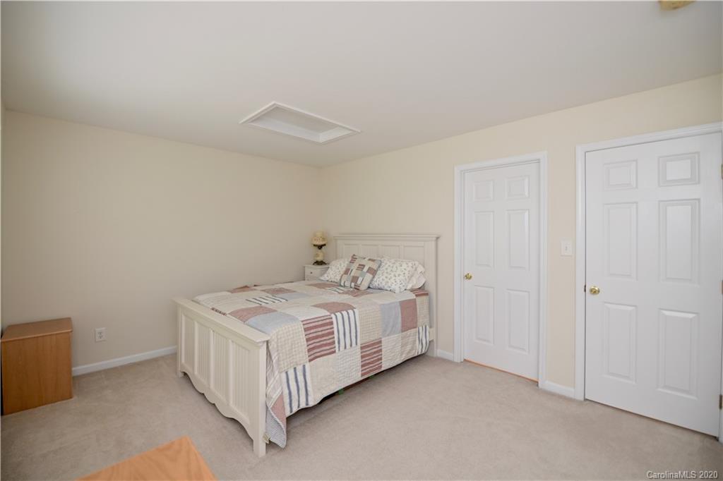 6152 Prosperity Church Road Charlotte, NC 28269 - Photo 26 of 33 a white bed sitting in a room