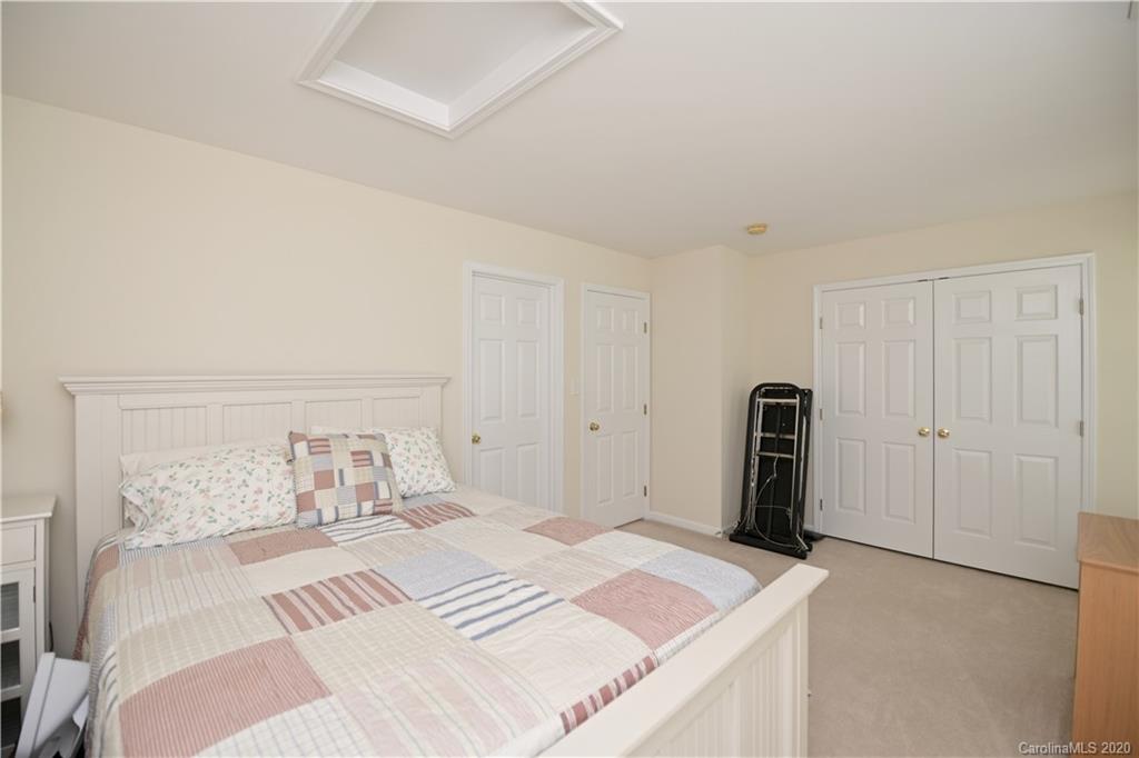 6152 Prosperity Church Road Charlotte, NC 28269 - Photo 27 of 33 a bedroom with a bed and a closet