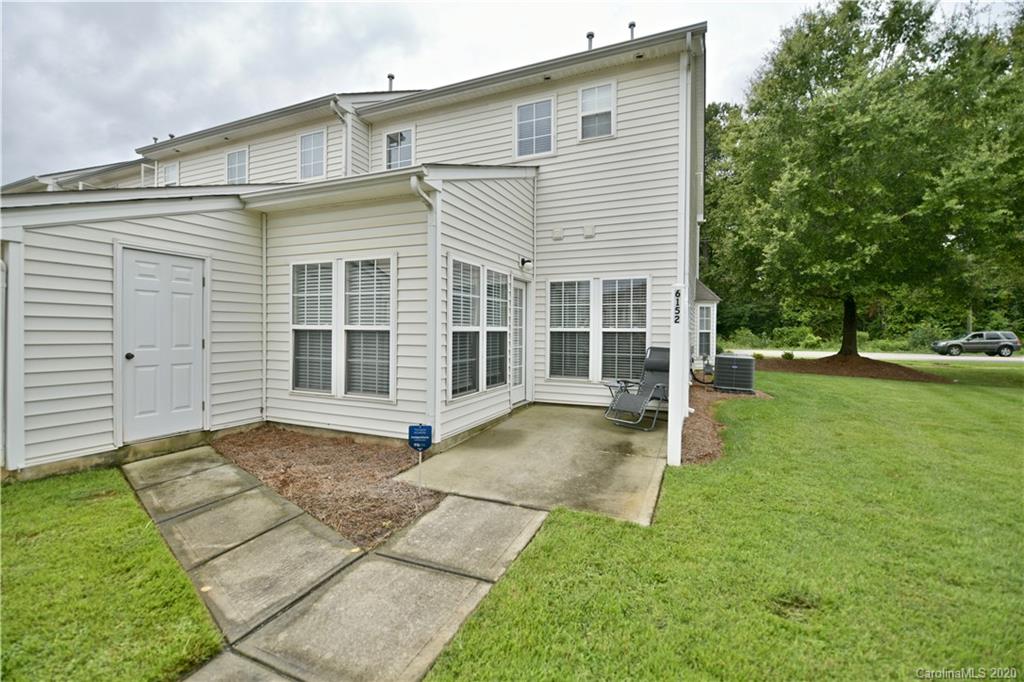 6152 Prosperity Church Road Charlotte, NC 28269 - Photo 30 of 33 a view of a house with a backyard