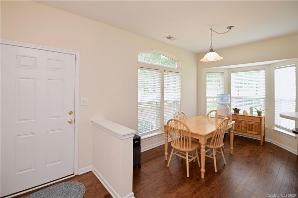 6152 Prosperity Church Road Charlotte, NC 28269 - Photo 7 of 33 a dining room with furniture window wooden floor