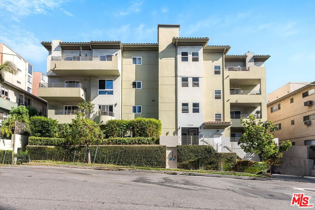 front view of a house with a small yard