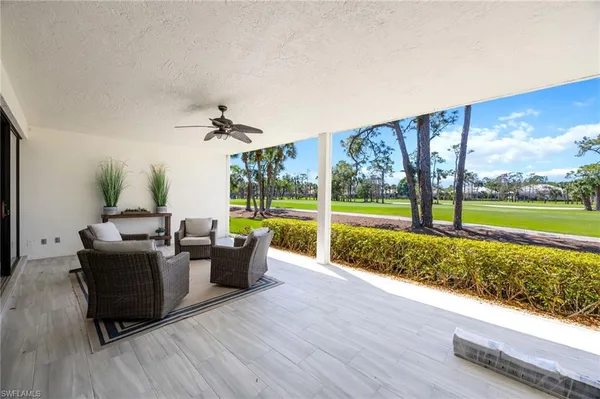 a living room with furniture and garden view