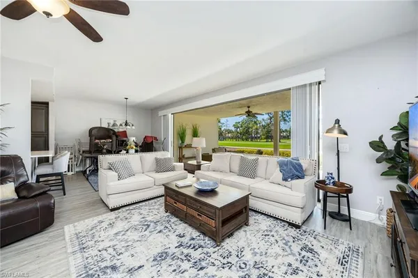 a kitchen with stainless steel appliances granite countertop a sink stove and microwave