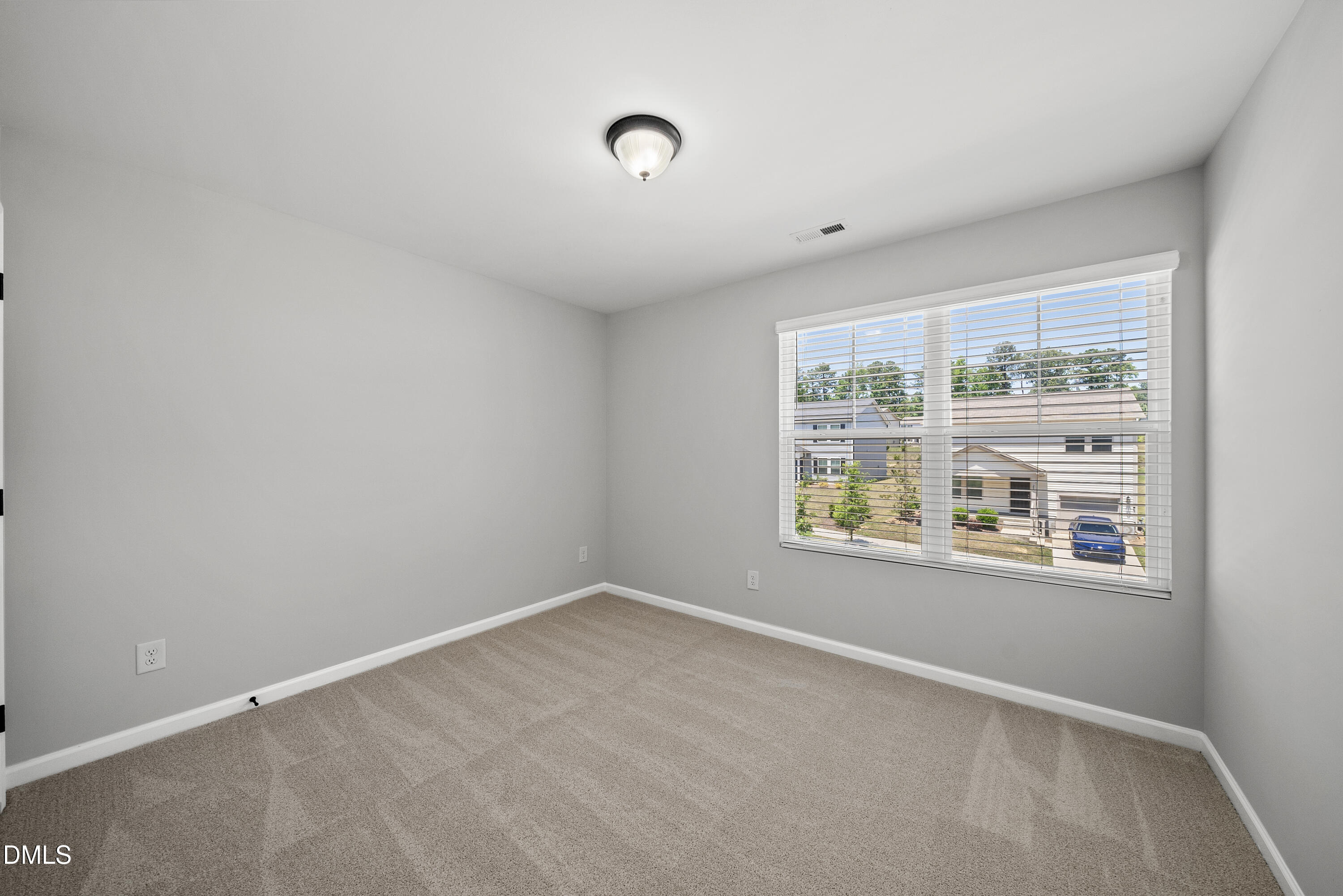 2816 Elsa Drive Raleigh, NC 27610 - Photo 31 of 35 an empty room with a window