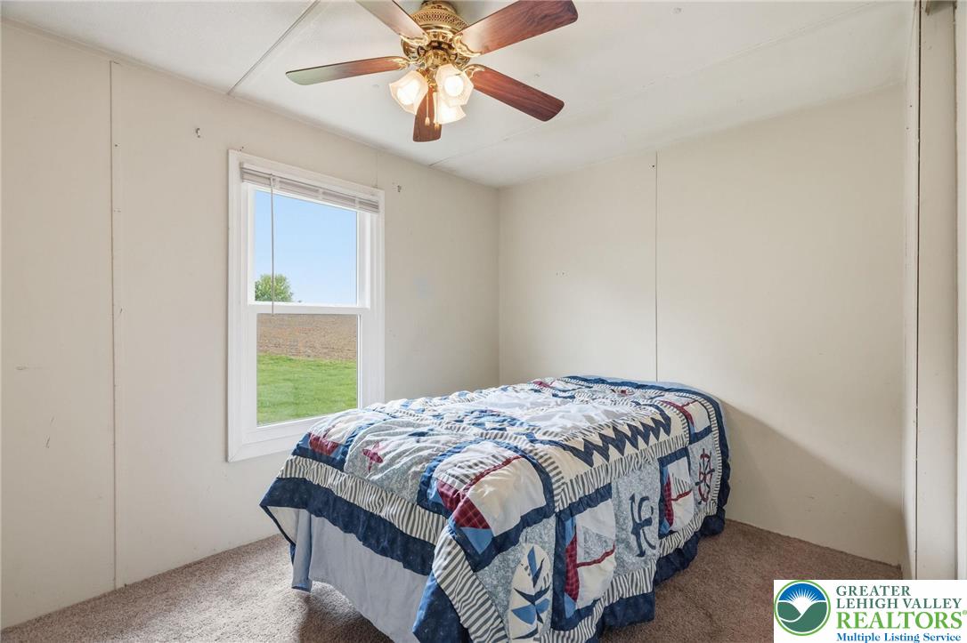 3101 Newburg Road Nazareth, PA 18064 - Photo 17 of 23 a bedroom with a bed and a window