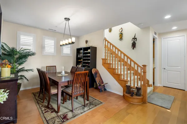 a view of a dining room with furniture window and entryway