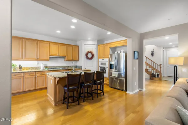a kitchen with a sink cabinets and window