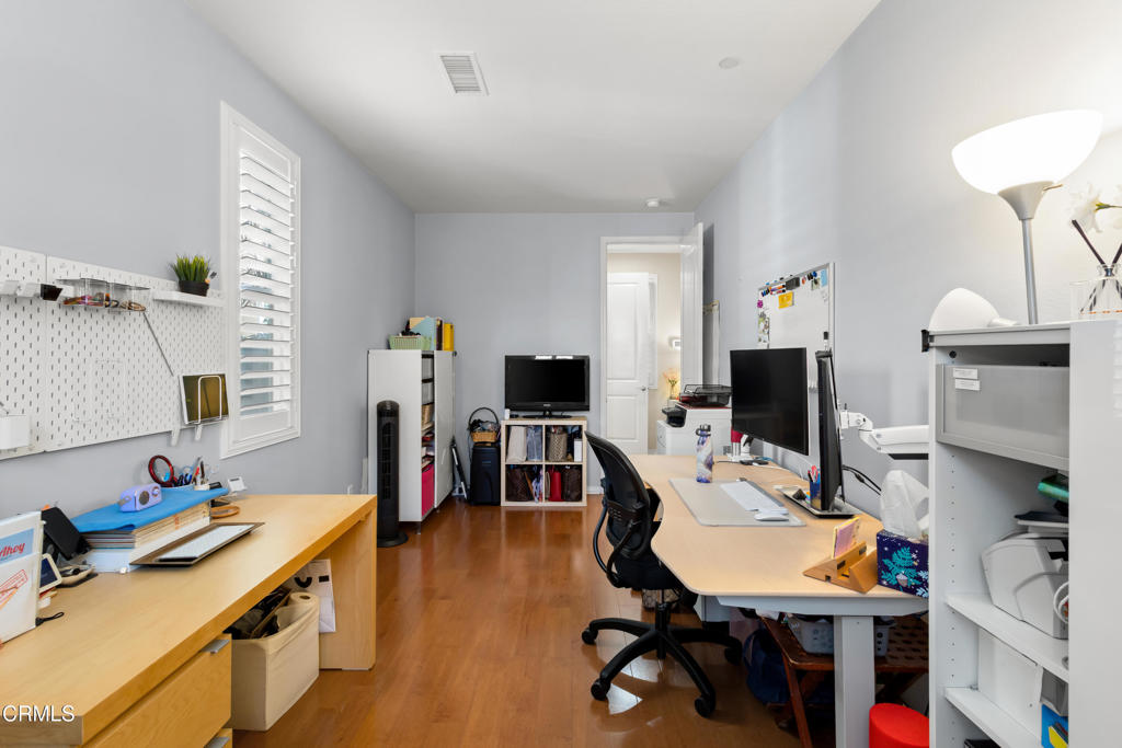 1365 Donegal Way Oxnard, CA 93035 - Photo 18 of 34 a view of a workspace with furniture and a bedroom