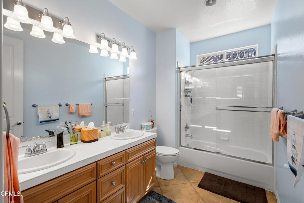 1365 Donegal Way Oxnard, CA 93035 - Photo 21 of 34 a bathroom with a sink a toilet and shower