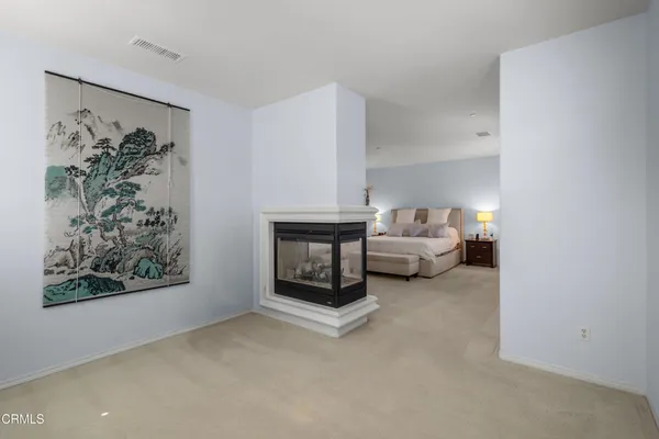 a living room with furniture and a painting