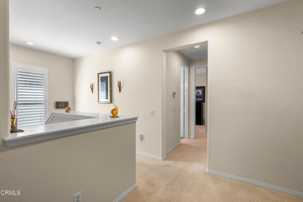 1365 Donegal Way Oxnard, CA 93035 - Photo 32 of 34 a living room with a couch and a dresser with wooden floor