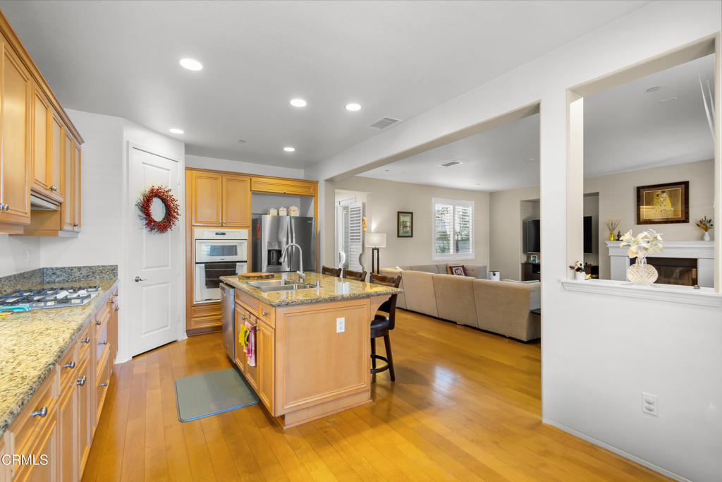1365 Donegal Way Oxnard, CA 93035 - Photo 10 of 34 a kitchen with a stove a refrigerator and a stove top oven