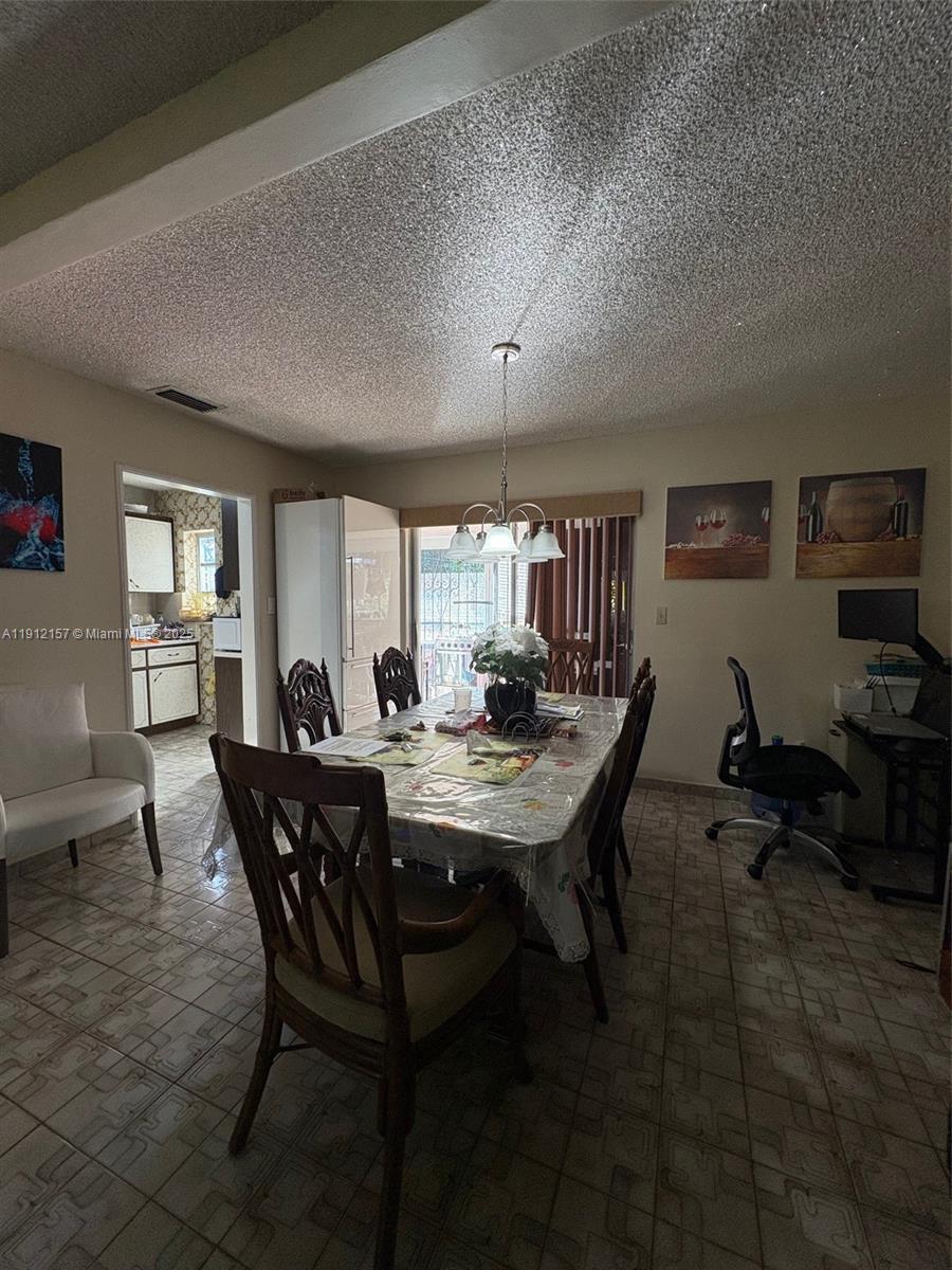 536 East 27th Street, Unit 536 Hialeah, FL 33013 - Photo 4 of 11 a view of a dining room with furniture