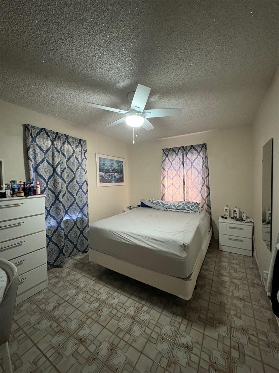 536 East 27th Street, Unit 536 Hialeah, FL 33013 - Photo 7 of 11 a spacious bedroom with a bed and a window