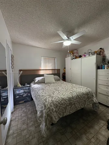 a bedroom with a bed and a closet