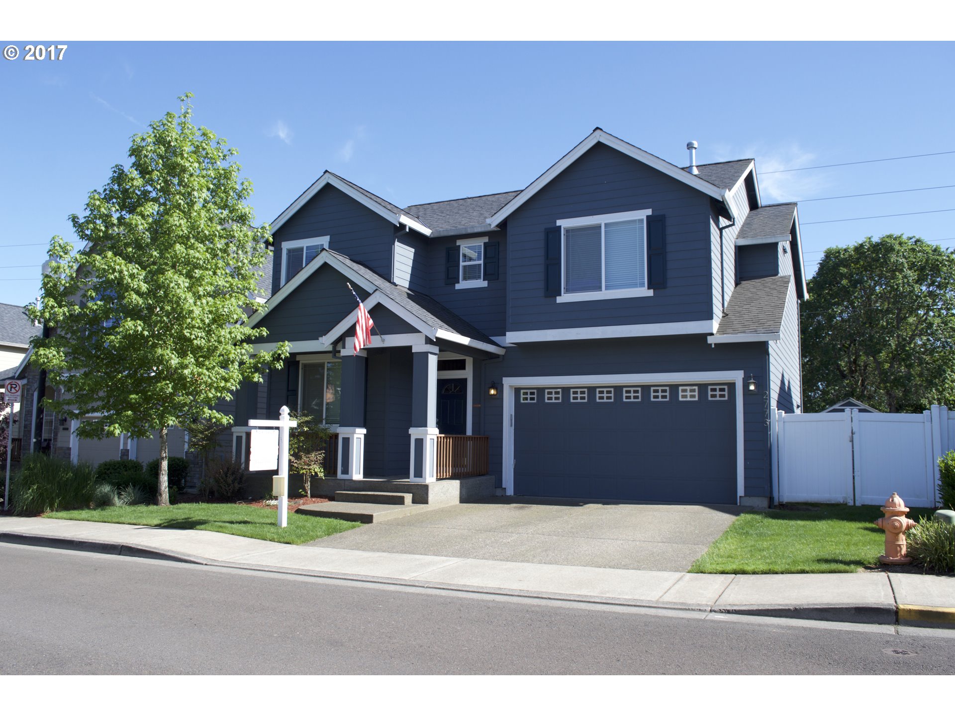 2773 North Fremont Street Cornelius, OR 97113 - Photo 1 of 24 a front view of a house with a yard and garage