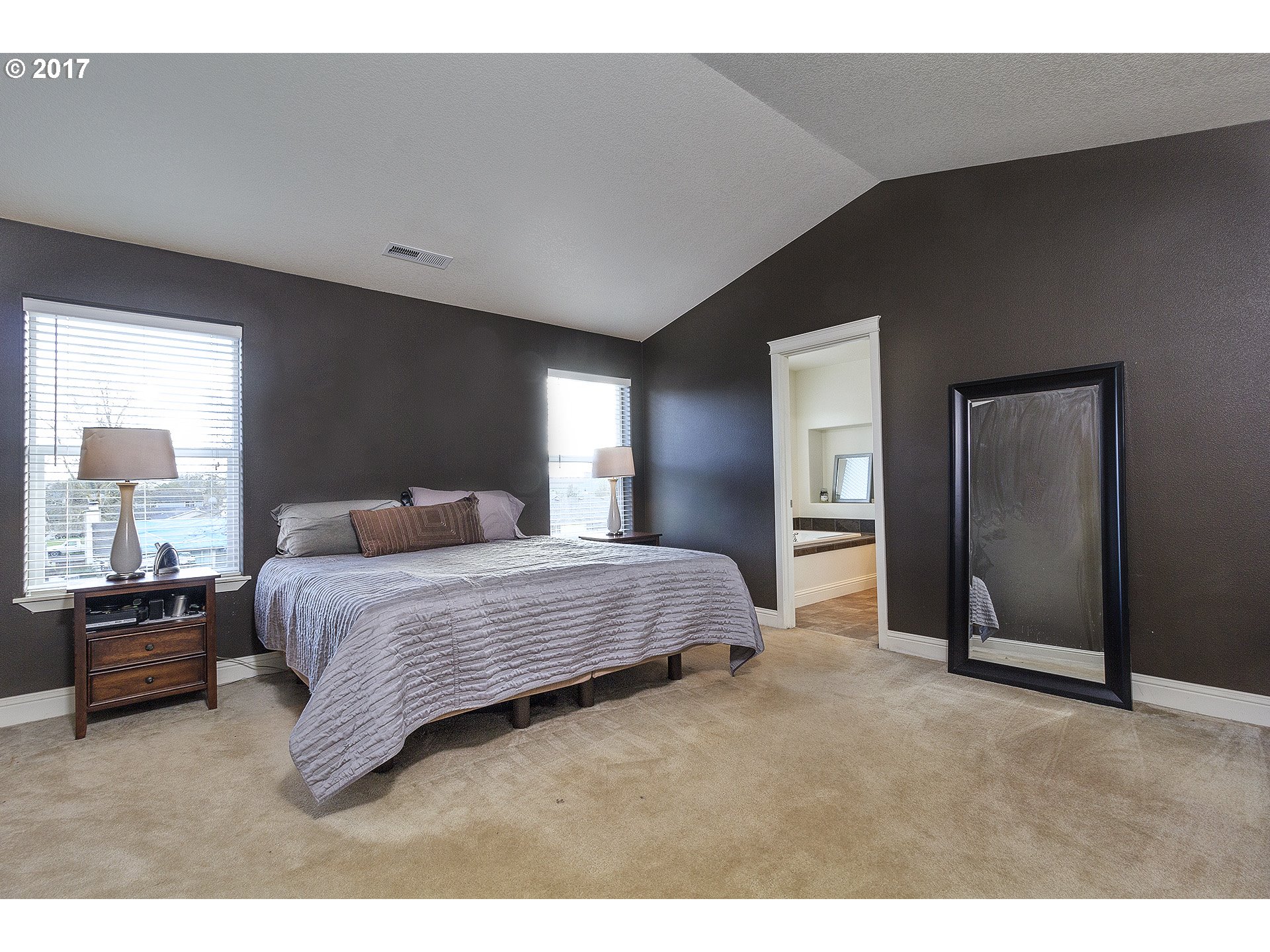2773 North Fremont Street Cornelius, OR 97113 - Photo 12 of 24 a bedroom with a bed and a large mirror