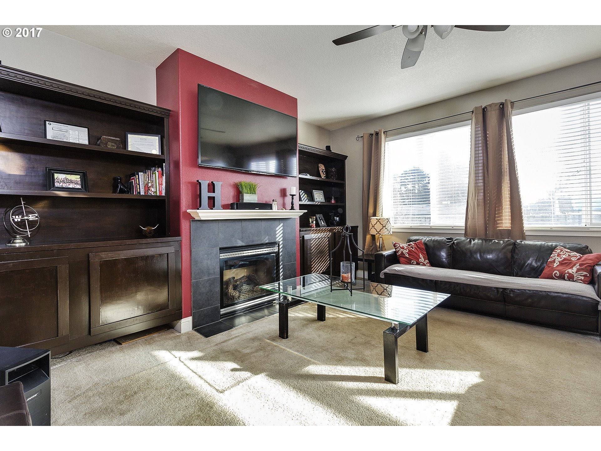 2773 North Fremont Street Cornelius, OR 97113 - Photo 5 of 24 a living room with furniture a flat screen tv and a fireplace