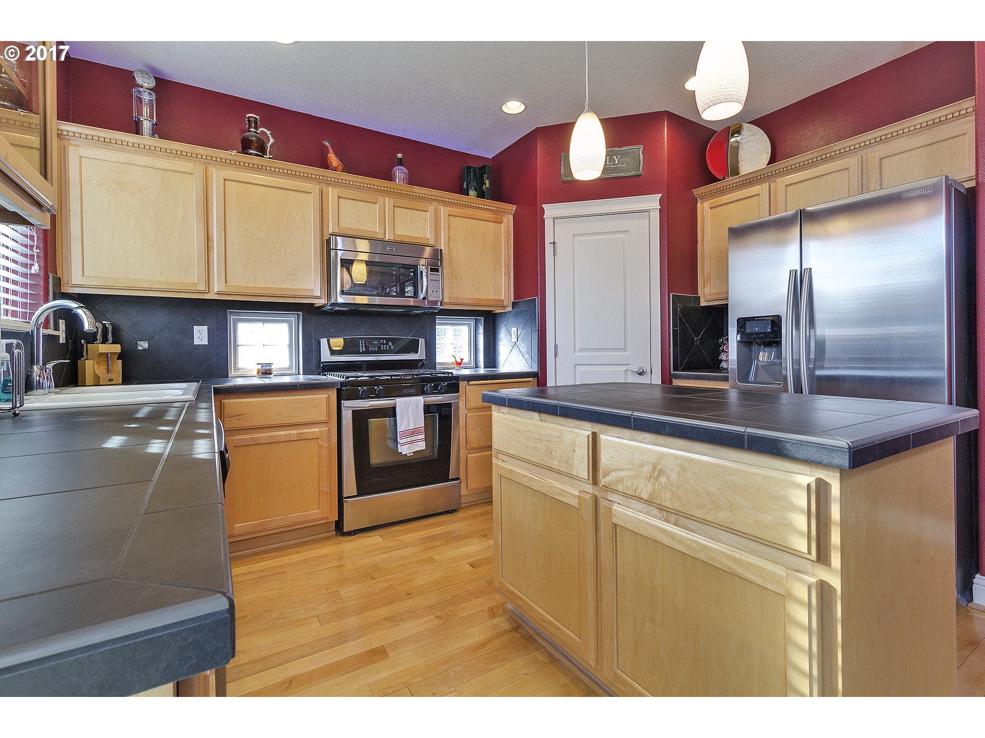 2773 North Fremont Street Cornelius, OR 97113 - Photo 7 of 24 a kitchen with stainless steel appliances granite countertop a sink and a refrigerator