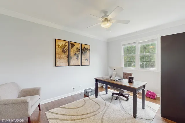 a work room with furniture and a window
