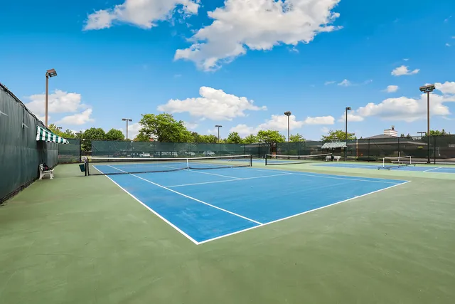 a view of an outdoor space and tennis court