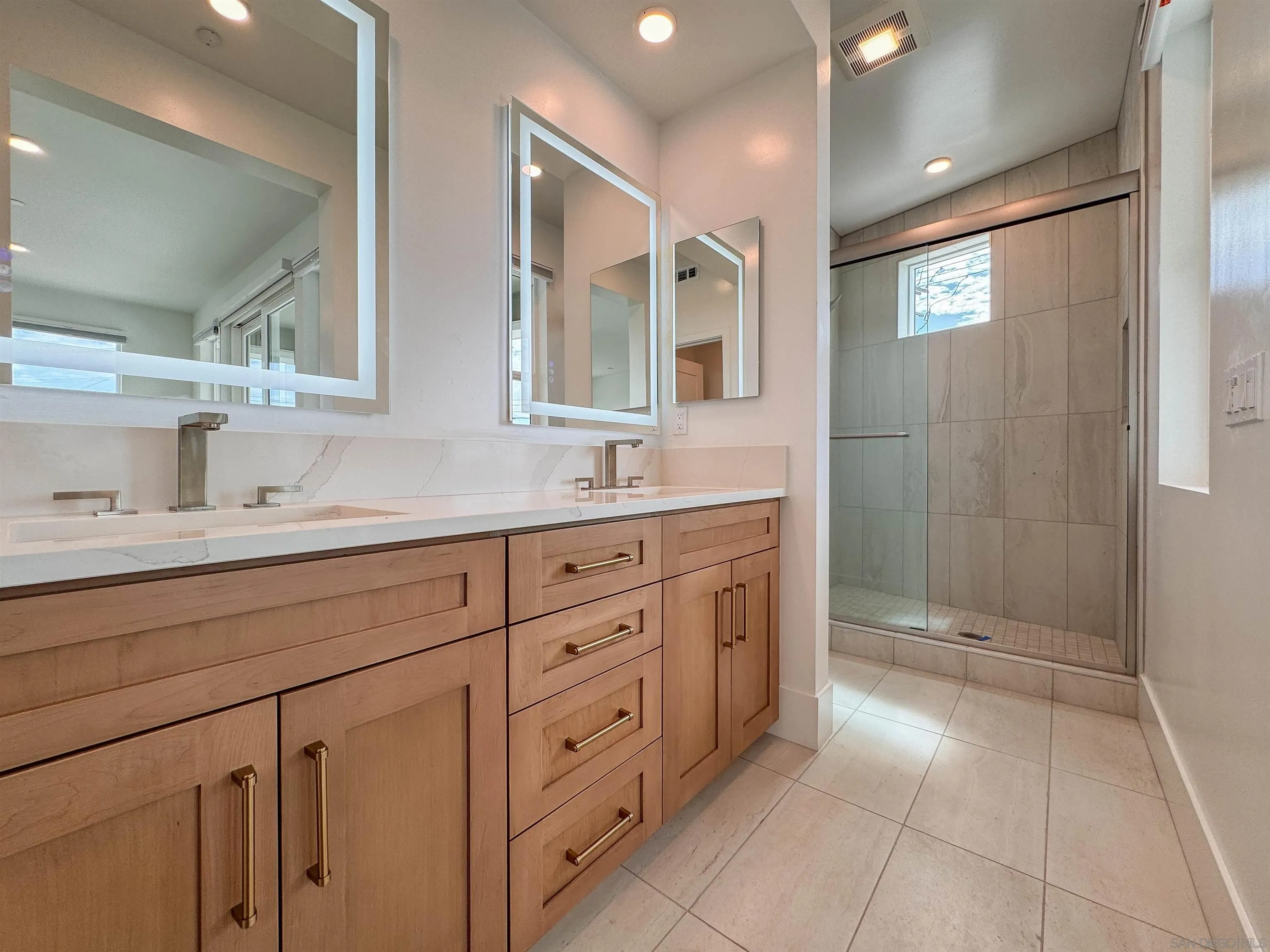 7290 Ponto Drive North, Unit 7302 Carlsbad, CA 92011 - Photo 20 of 55 a spacious bathroom with double sink and a mirror