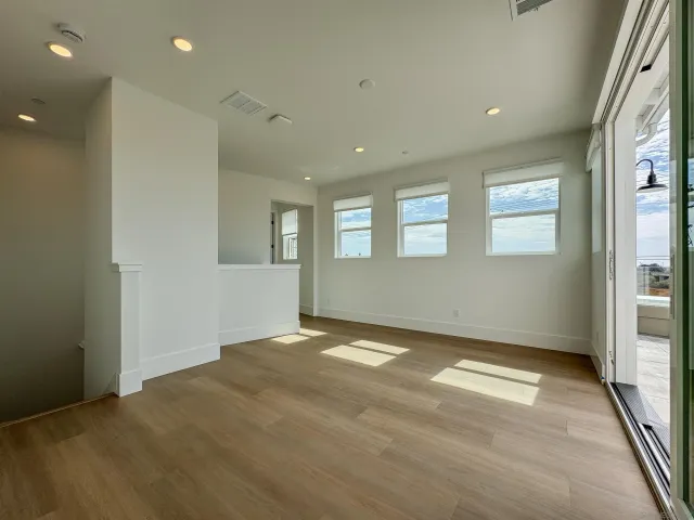 a bathroom with a toilet sink vanity tub and mirror